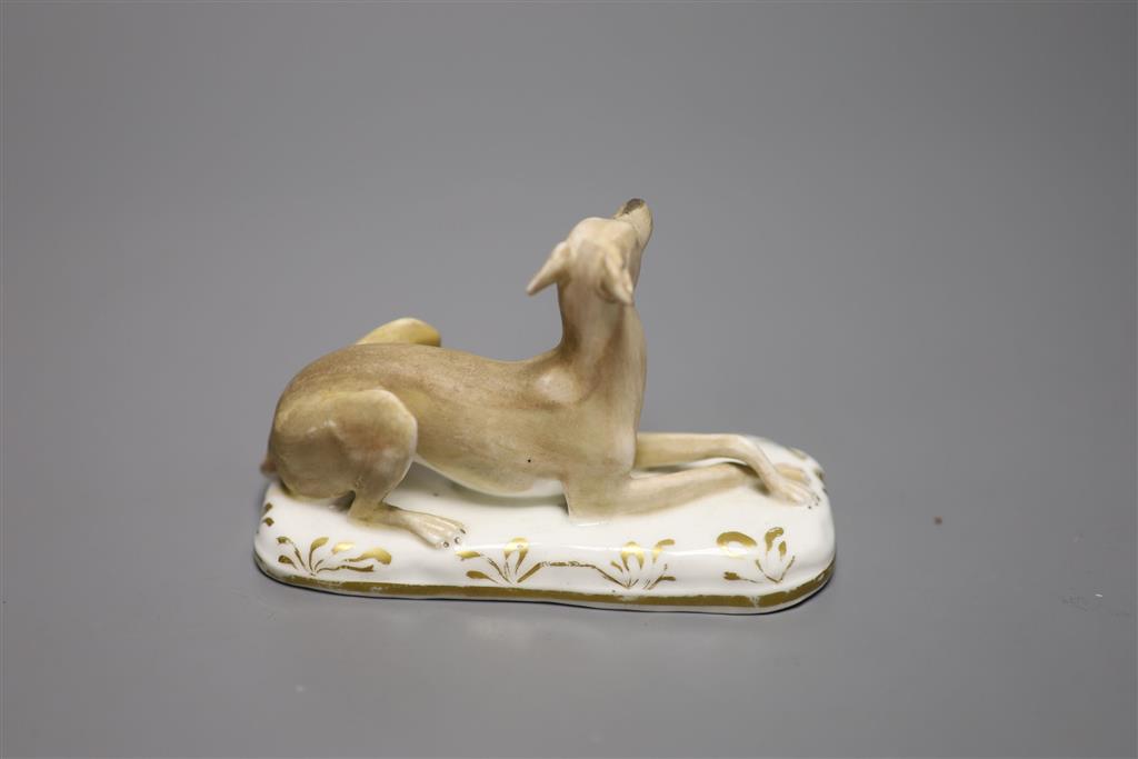 A Grainger, Lee & Co., Worcester porcelain greyhound, cushion base, c.1830, width 10cm